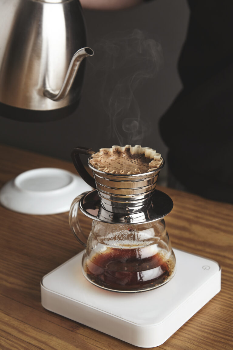 Close up of preparing filtered coffee in machine